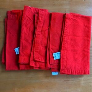 Five red dinner napkins